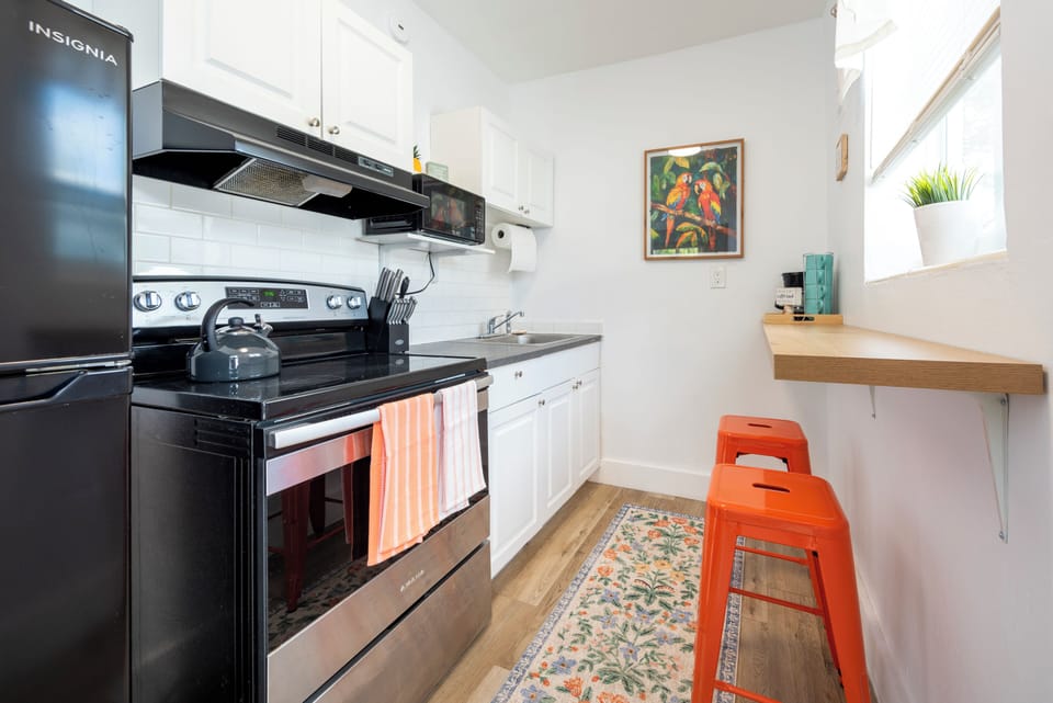full kitchen with coffee counter bar