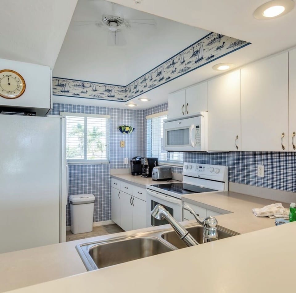 Fully stocked kitchen, microwave, oven, fridge, coffee station for guests