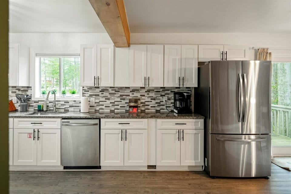 Enjoy the spacious kitchen counter, complete with a Keurig coffee maker for your morning brew and a large three-door fridge for all your groceries and snacks.