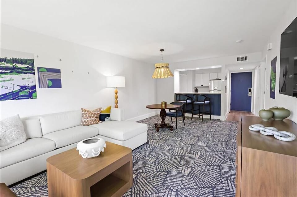 Unwind together in a spacious living room that blends relaxation with modern elegance.