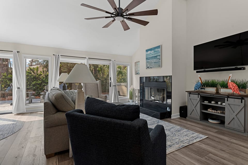 Comfortable gathering space with large TV and sound bar