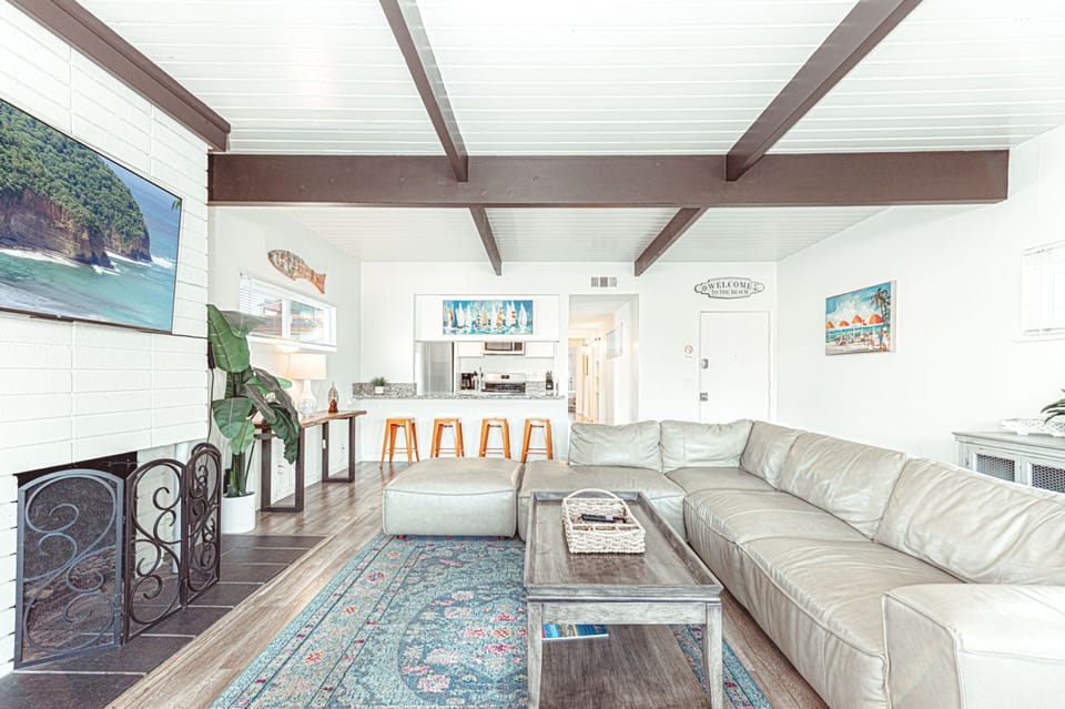 Refined living area with fireplace and relaxed coastal elegance
                