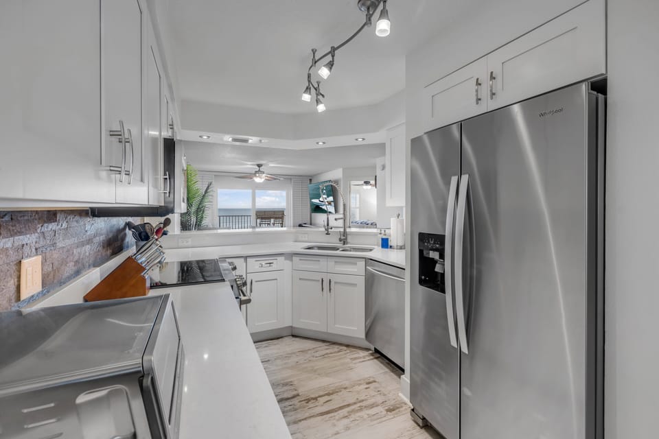 Cook with a view in this stunning, fully equipped kitchen featuring stainless steel appliances and beautiful oceanfront vistas