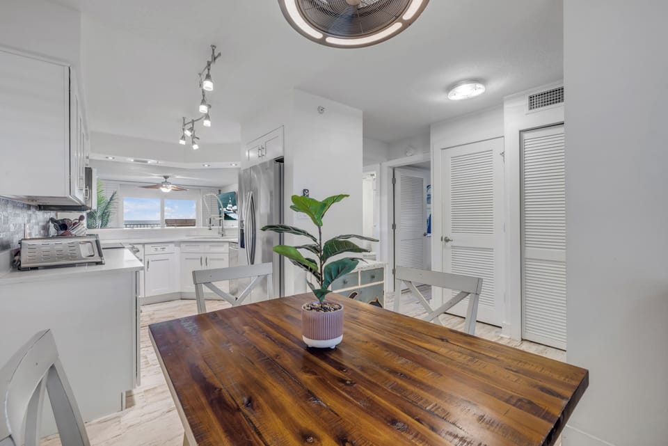 Enjoy meals together at the dining table for four, with bonus seating at on the kitchen barstools