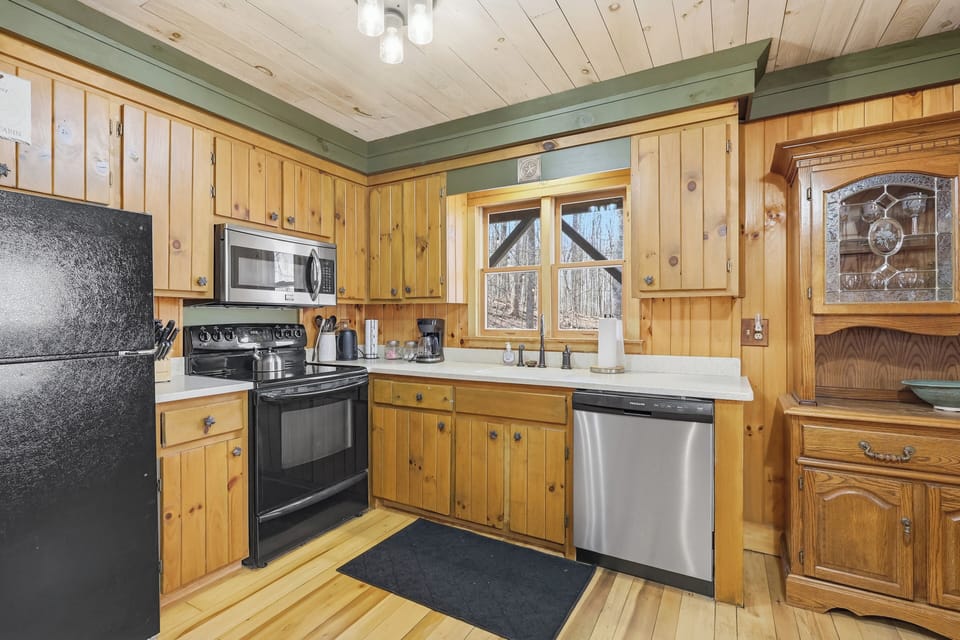 Fully equipped kitchen with stainless steel appliances and granite counters