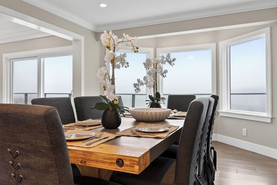 Detailed view of the rustic wood dining table set for guests.