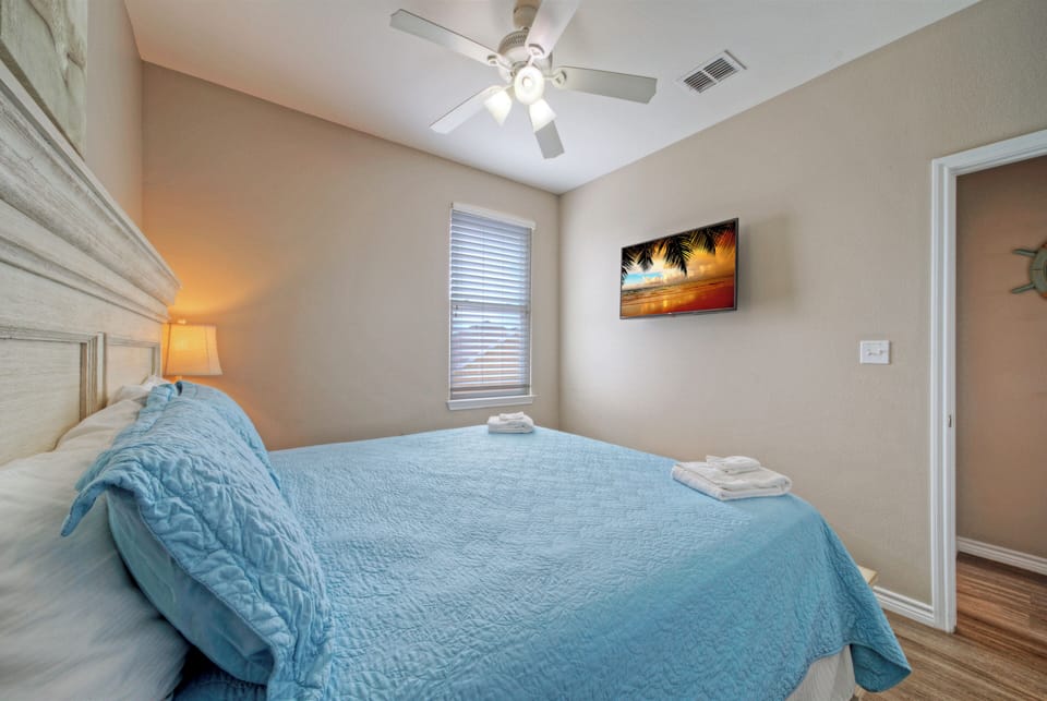 Bedroom 4 features a king bed and a TV. 