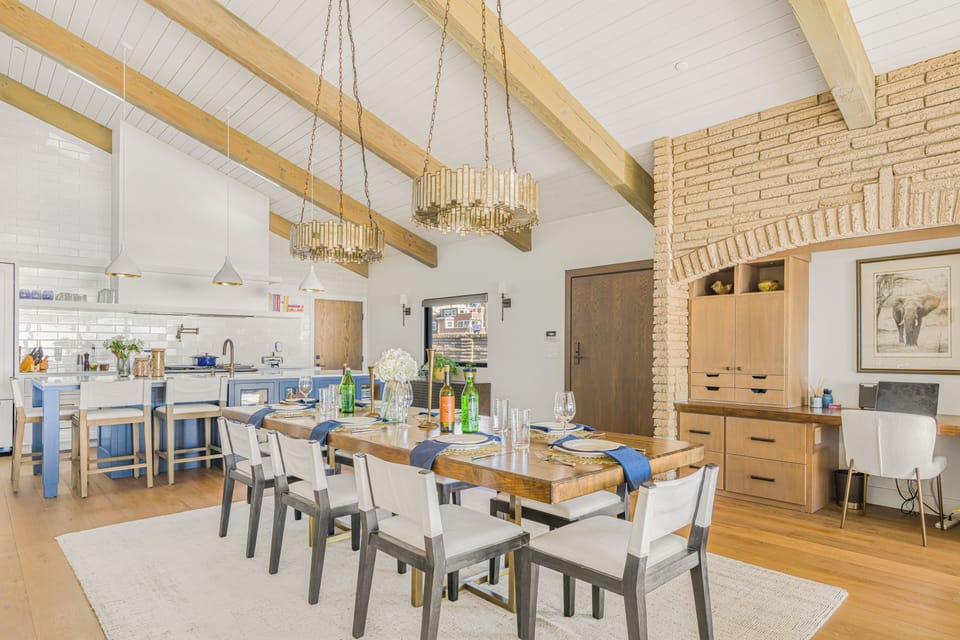 Dining with a long wooden table, perfect for group meals.