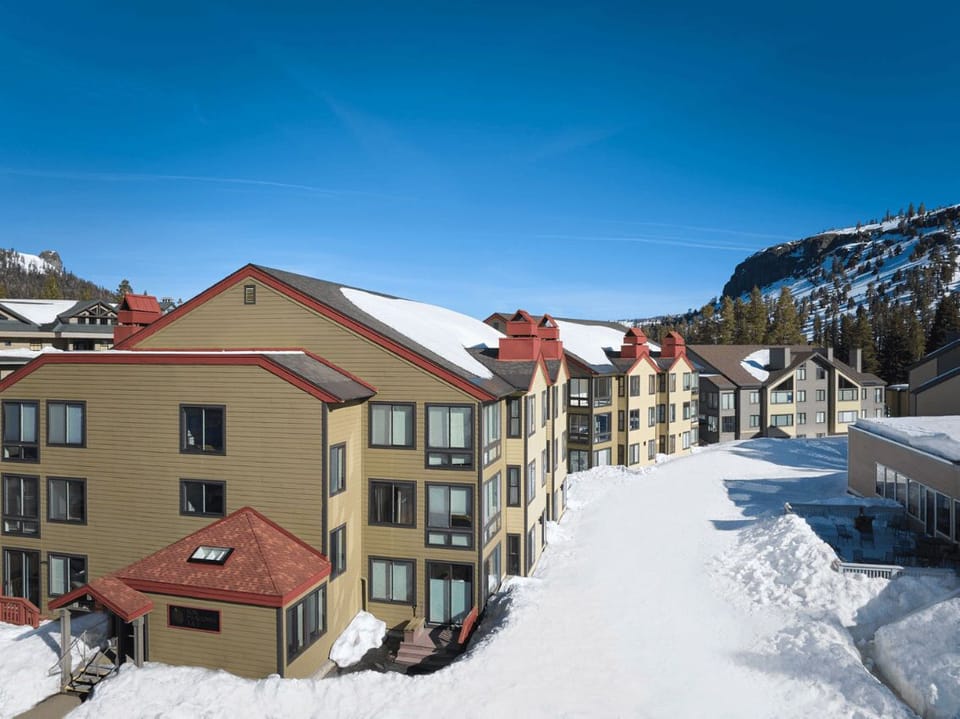 Nestled in the snow, these condos invite you to relax in a winter paradise.