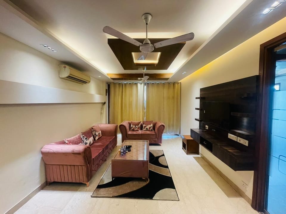 Apartment, Golf View | Living area | 43-inch Smart TV with digital channels