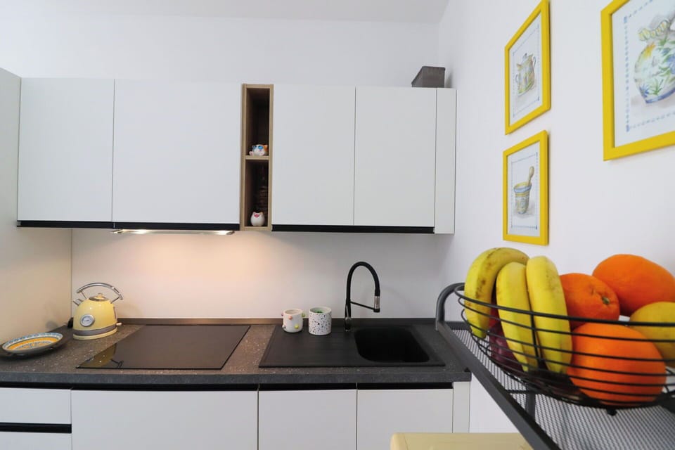 Kitchen, Countertop, Kitchen Appliance, Interior Design, Cabinetry, Major Appliance, Furniture, Home Appliance, Lighting, Flooring