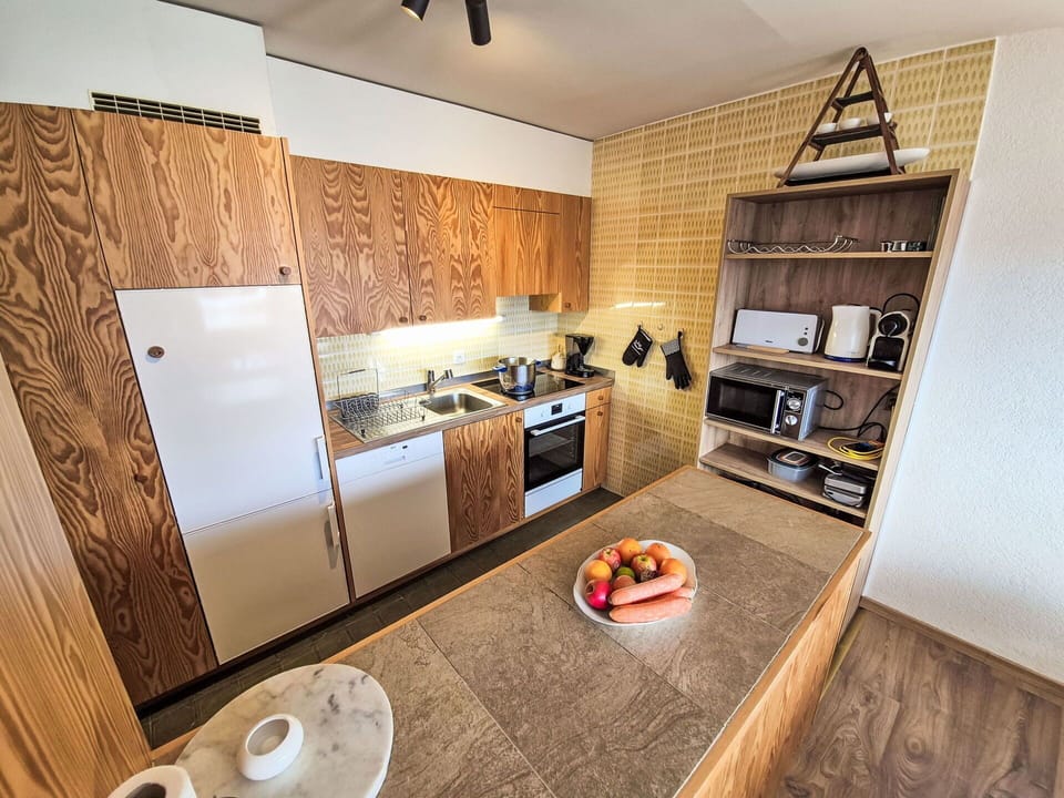 Flooring, Wood, Floor, Countertop, Furniture, Kitchen, Interior Design, Cabinetry, Brown, Major Appliance