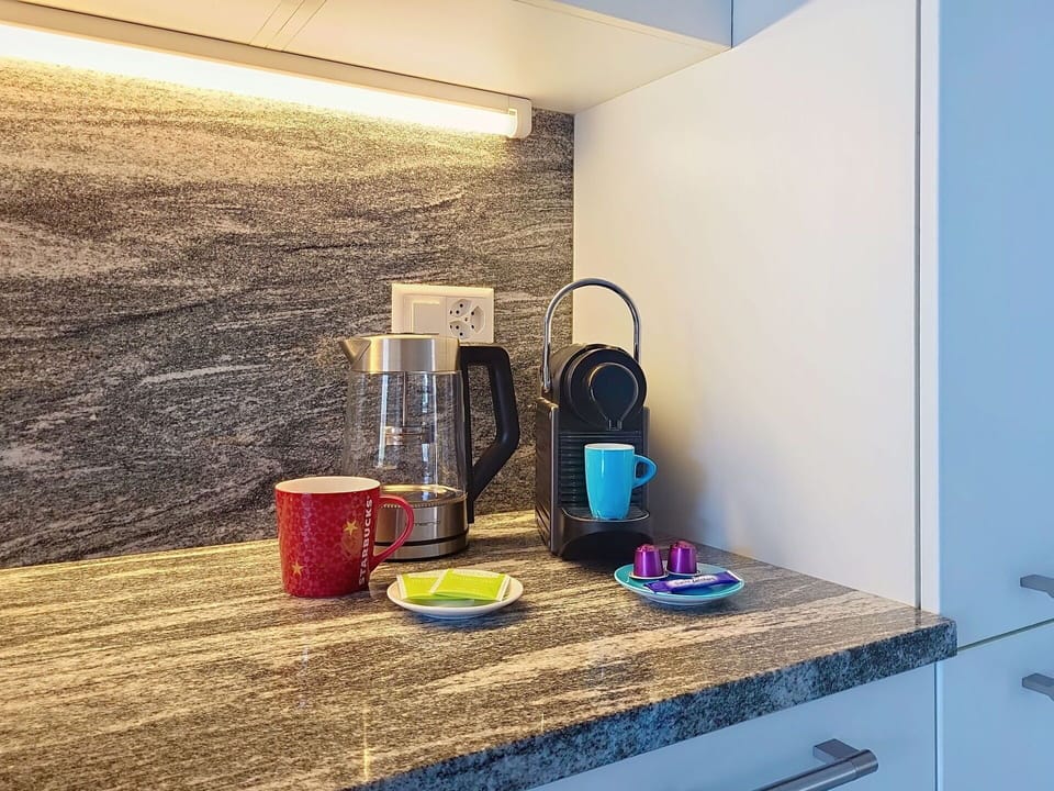 Countertop, Interior Design, Kitchen, Kitchen Appliance, Home Appliance, Cabinetry, Tap, Houseplant, Under-Cabinet Lighting, Major Appliance