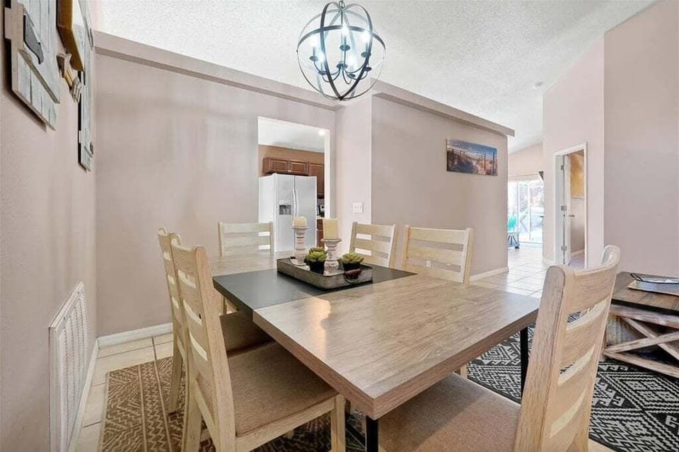 Featuring a beautifully finished wooden dining table that embodies timeless elegance and craftsmanship.