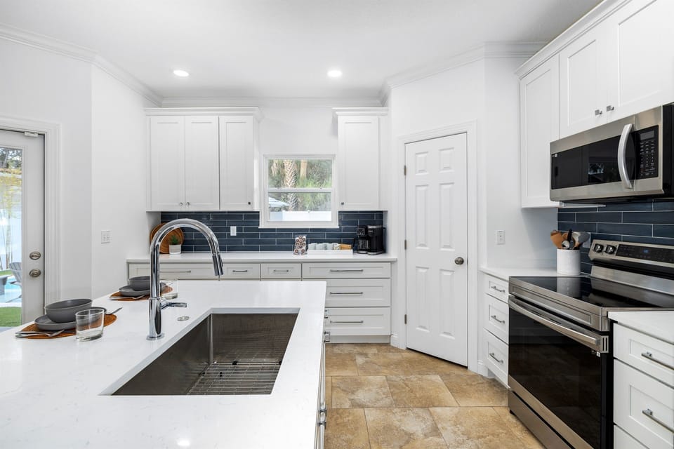 Bright, fully stocked kitchen with everything you will need to prepare meals for the whole group.