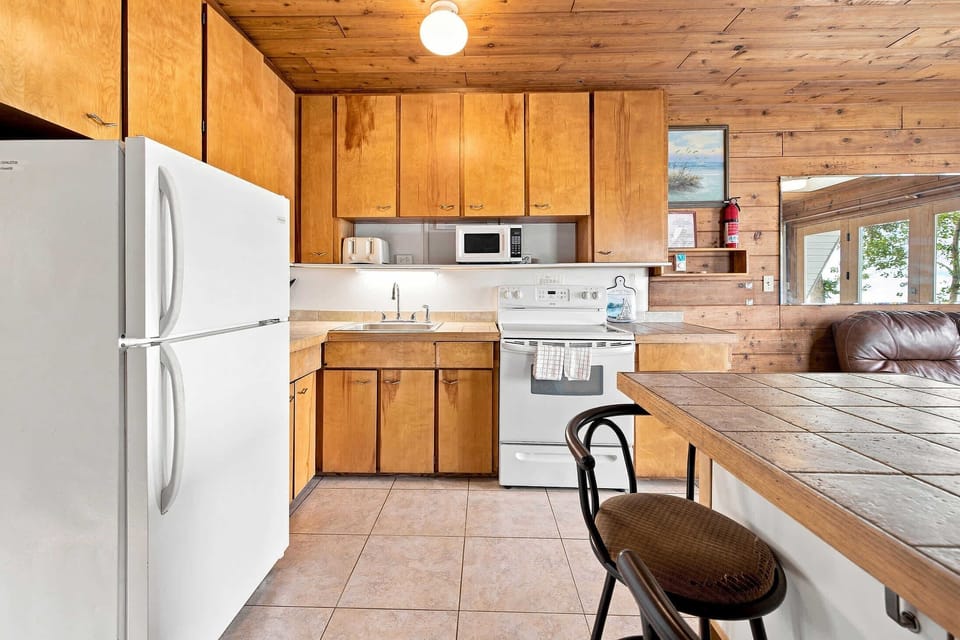 Main-level kitchen with full-size appliances for easy meals at the chalet.