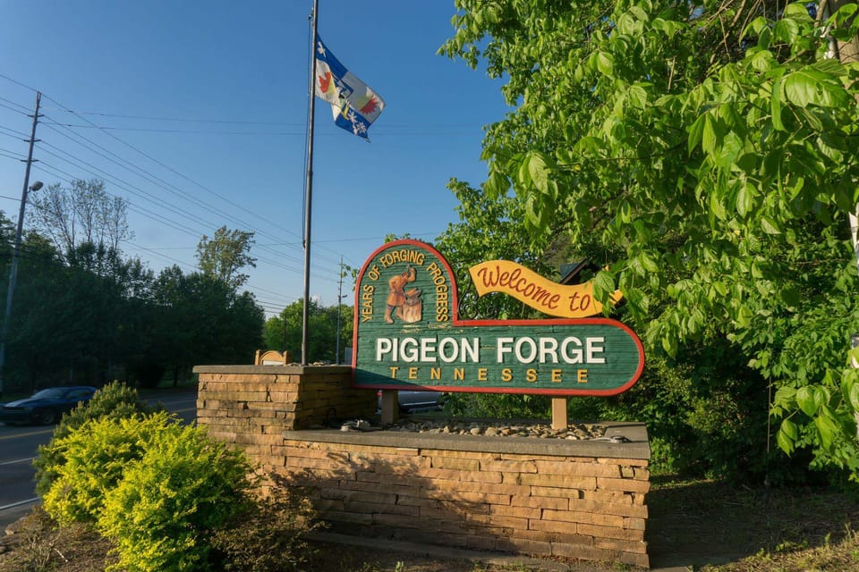 Welcome to Pigeon Forge, Tennessee! This iconic town entrance sign marks your arrival at the gateway to Great Smoky Mountains adventures.