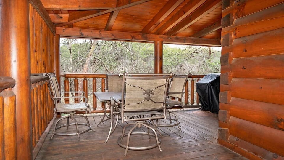 Step onto your private covered porch and sink into classic Adirondack chairs surrounded by warm, natural log walls. A perfect spot to start your morning coffee or unwind at day's end.