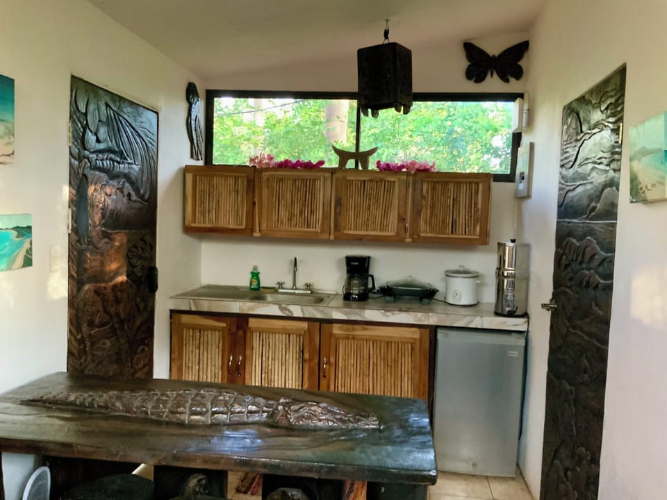 Fridge, coffee maker, and cooking basics included