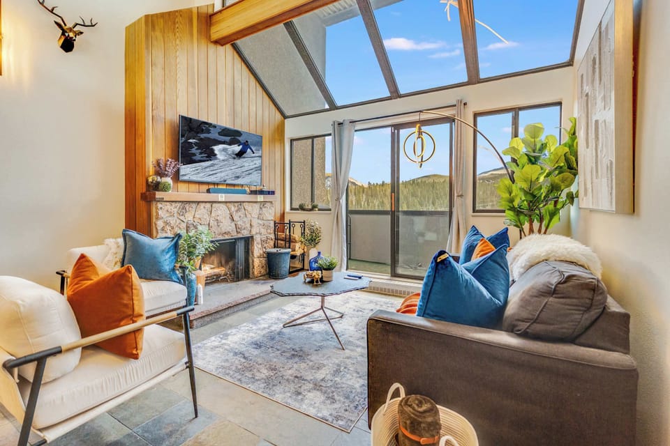 Curated by the Sapphire Bespoke Retreats design team.  Safir Haus living room features custom furnishings and contemporary comfort.  Featuring views of Breckenridge Ski Resort, Ski Lift, and Mount Baldy.