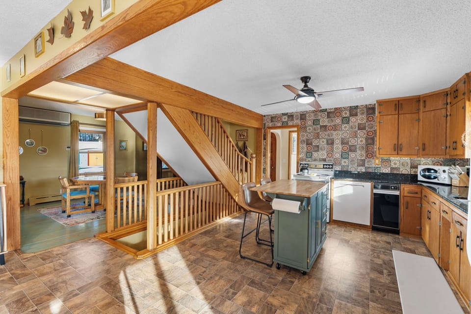 Warm wooden beams and rustic charm create your perfect cooking space, where morning coffee and family meals become cherished memories.