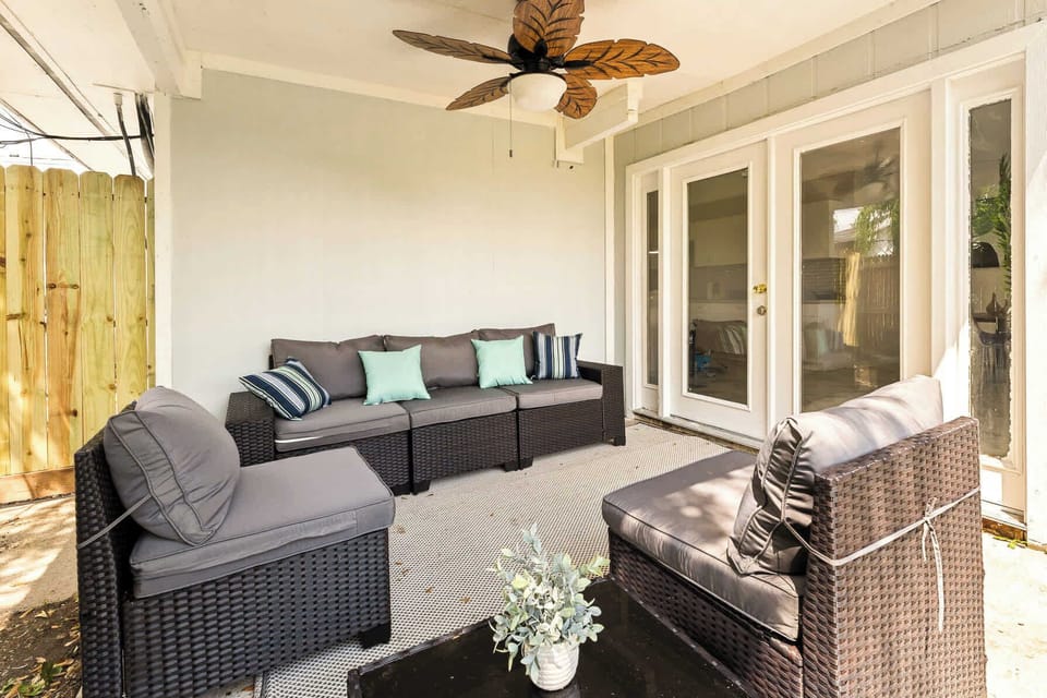 Outdoor, covered seating with stylish fan