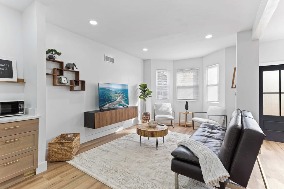 Inviting living space featuring comfortable seating, natural light, and a sofa bed for added flexibility. Perfect for relaxing, streaming your favorite shows, or accommodating extra guests.