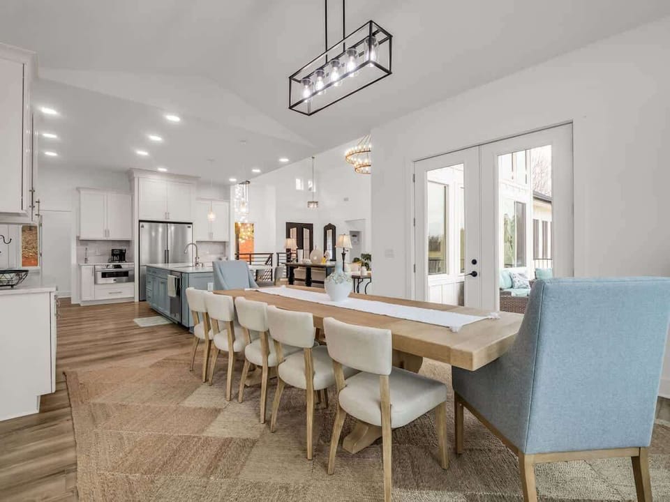 Gather around this beautiful dining table for shared meals, laughter, and heartfelt conversations. The open layout and elegant lighting create the perfect setting for unforgettable moments with family and friends.