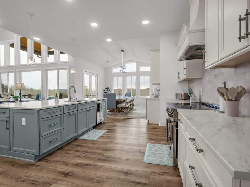 This bright, modern kitchen invites everyone to join in. Prep meals at the large island, share stories over coffee, and enjoy quality time with friends and family.
