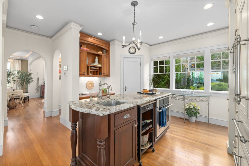 Second island with built-in oven & secondary sink for extra prep space.