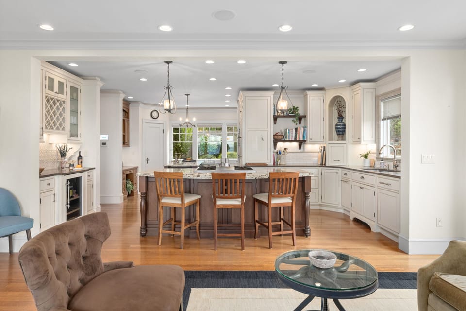 Kitchen bar seating with room to gather, socialize, and enjoy the open layout.