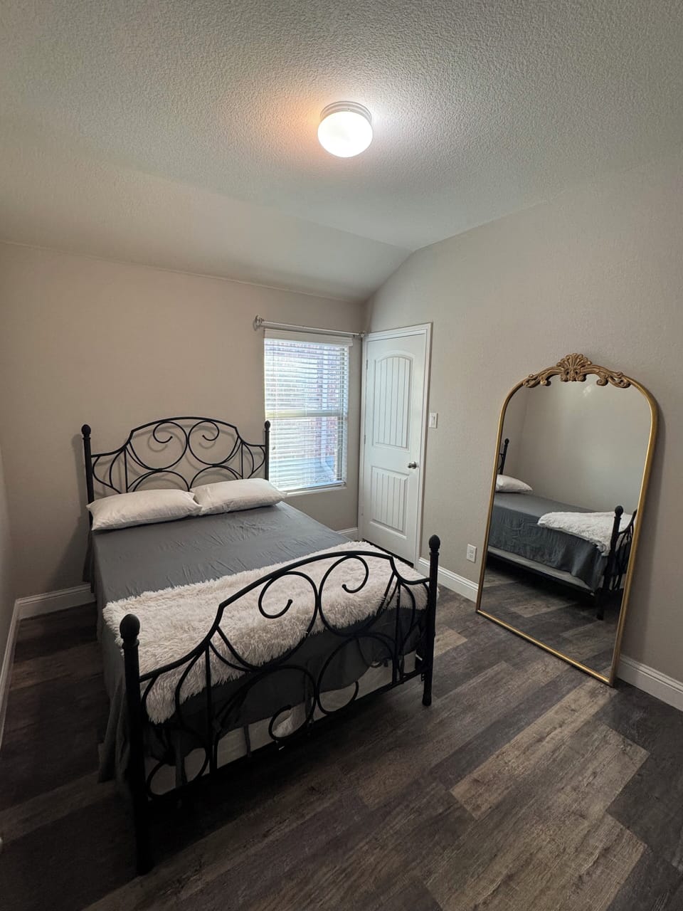 Guest bedroom with full-size bed, fresh linens, and a cozy, welcoming feel