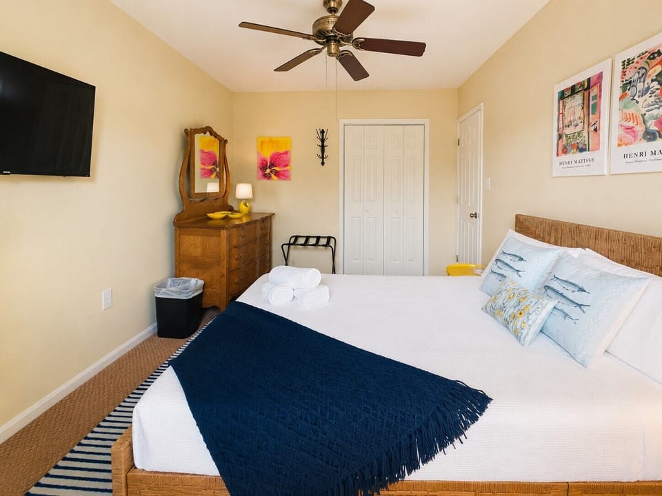 Bedroom 2: Queen bed, smart tv, closet space, ceiling fan & charging station