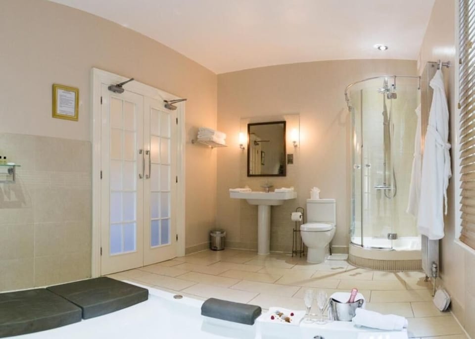 Signature Suite, Patio, Garden View | Bathroom | Separate tub and shower, hair dryer, towels, soap