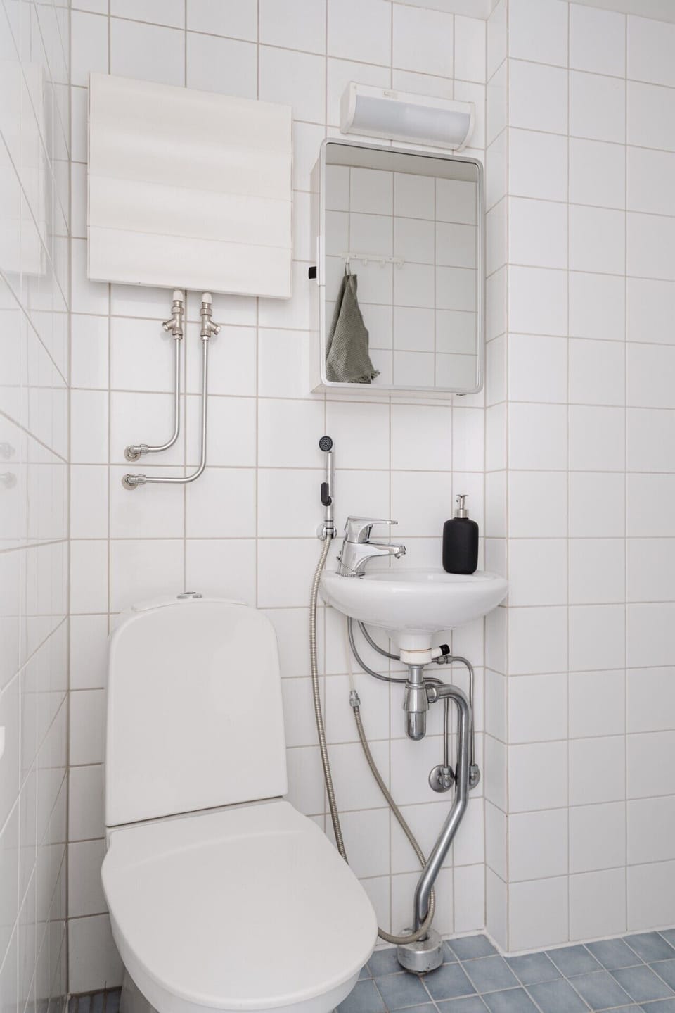 Our compact bathroom is fully equipped with essentials like shampoo and soap for your convenience.