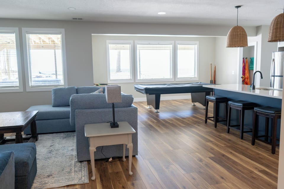 Basement Living area, Full Kitchen, Half Bath, Walk out Patio and Pool Table