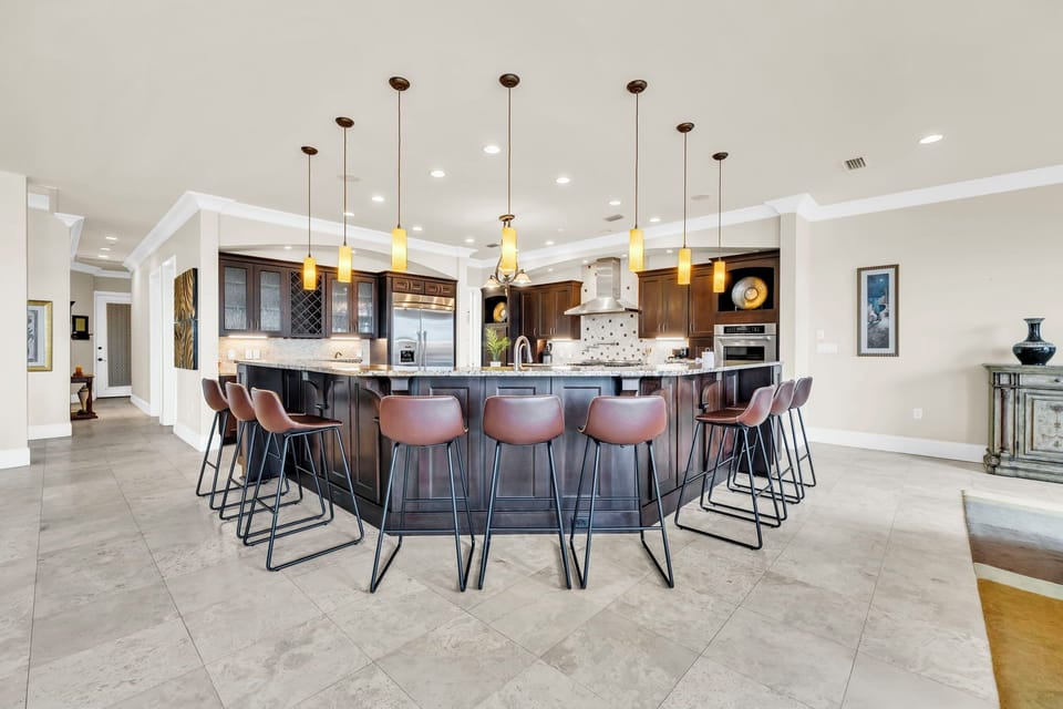 Your dream kitchen awaits with a stunning oversized island, premium stainless appliances, and stylish bar seating ideal for morning coffee or evening conversations.