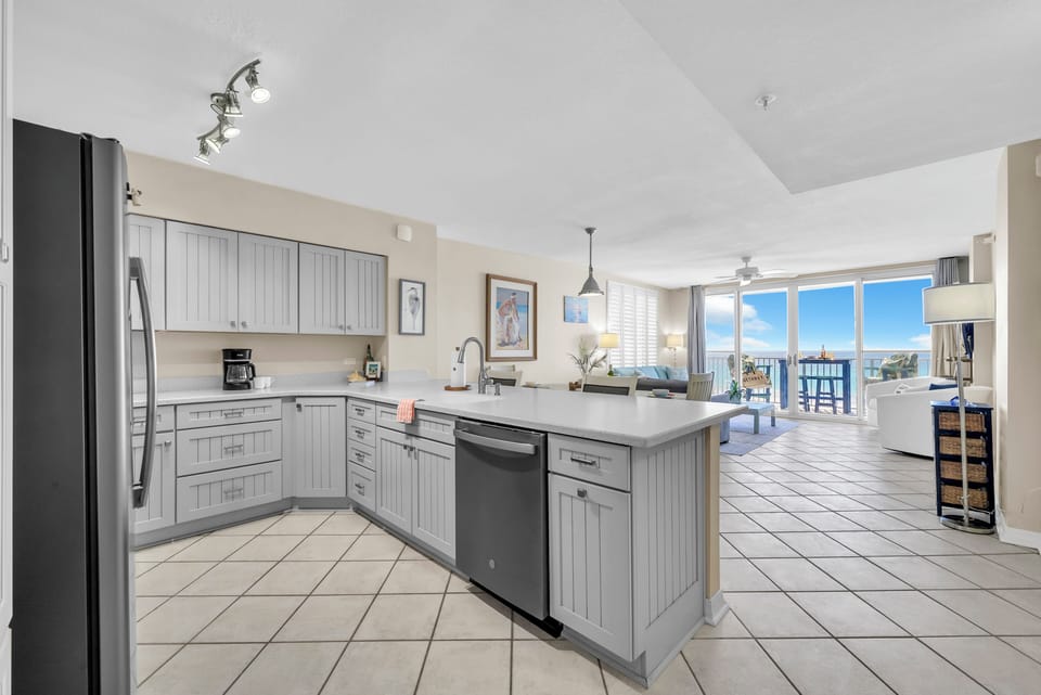 A light-filled kitchen with ample workspace and a smooth connection to dining and living spaces.