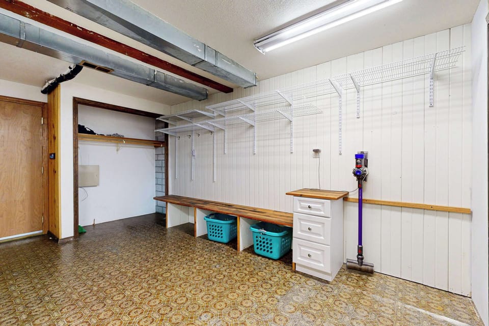 Lower level: laundry room with full bathroom beyond