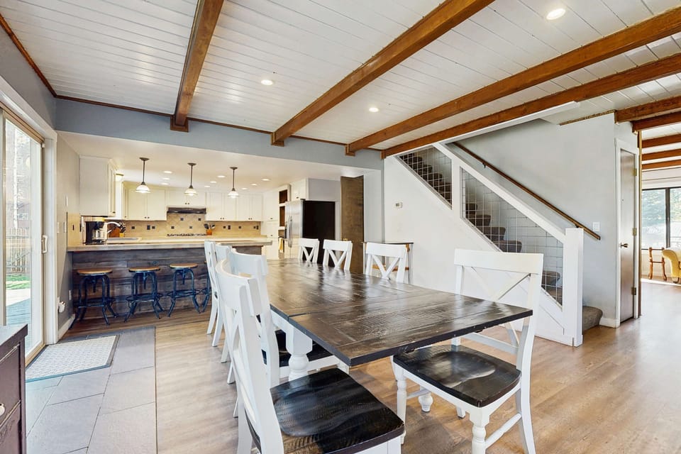 Main level: Open concept dining room and kitchen (living room is beyond stairs)