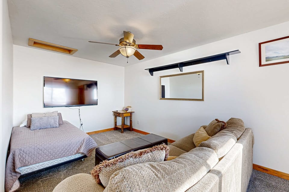 Upper level: Loft area with couch and twin bed