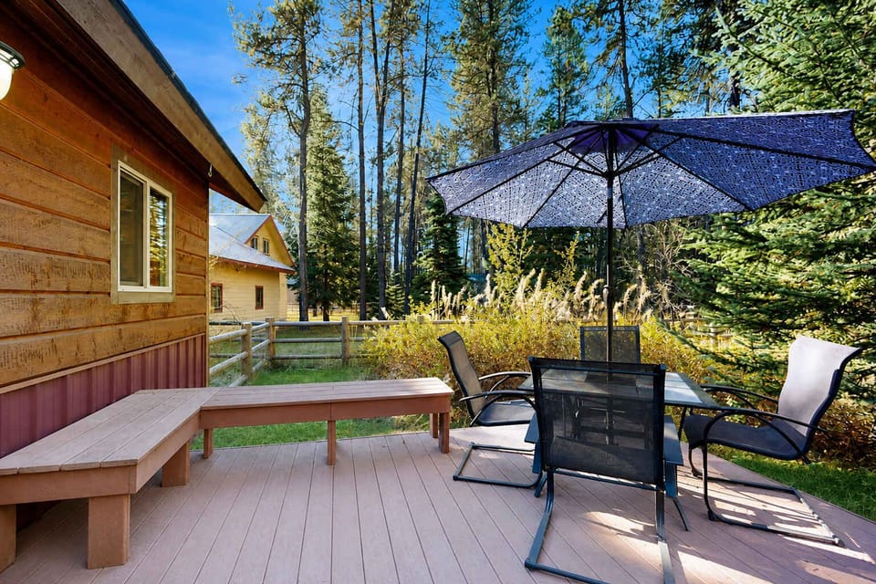 Outdoor deck with built in bench and outdoor dining table. Fenced in back yard, perfect for dogs (pet friendly home). 