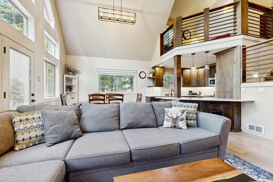 Open concept living space and loft above