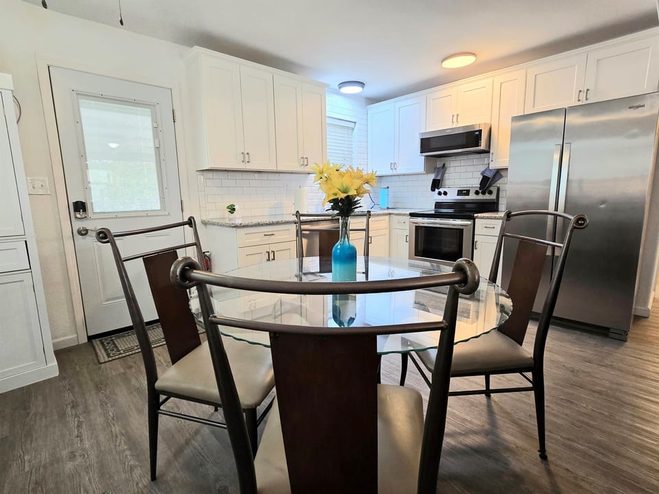 The kitchen is fully stocked with cooking & eating equipment, blender, crockpot, glass stop stove, dishwasher & large fridge. You'll have starter supplies of Keurig pods, sweetener, dishwasher soap, paper towel as well as cooking oil and some spices. 