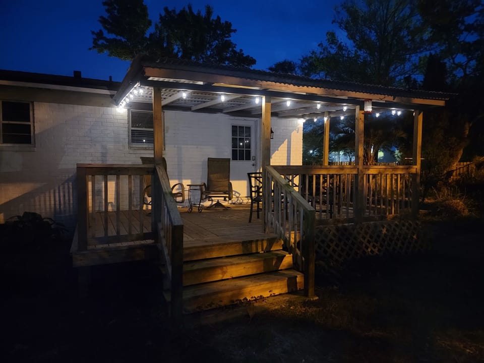 Enjoy the back porch with lights and comfy seating in the cool evening breeze over dinner or a cocktail with your sweetie.