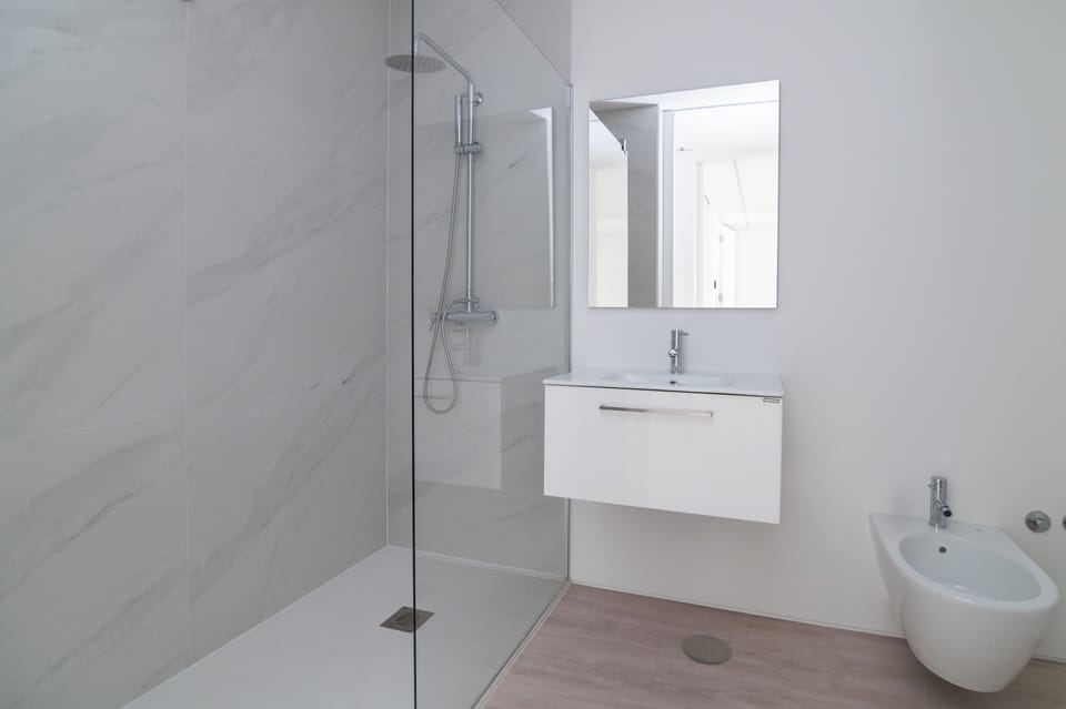 Shower, rainfall showerhead, hair dryer, towels