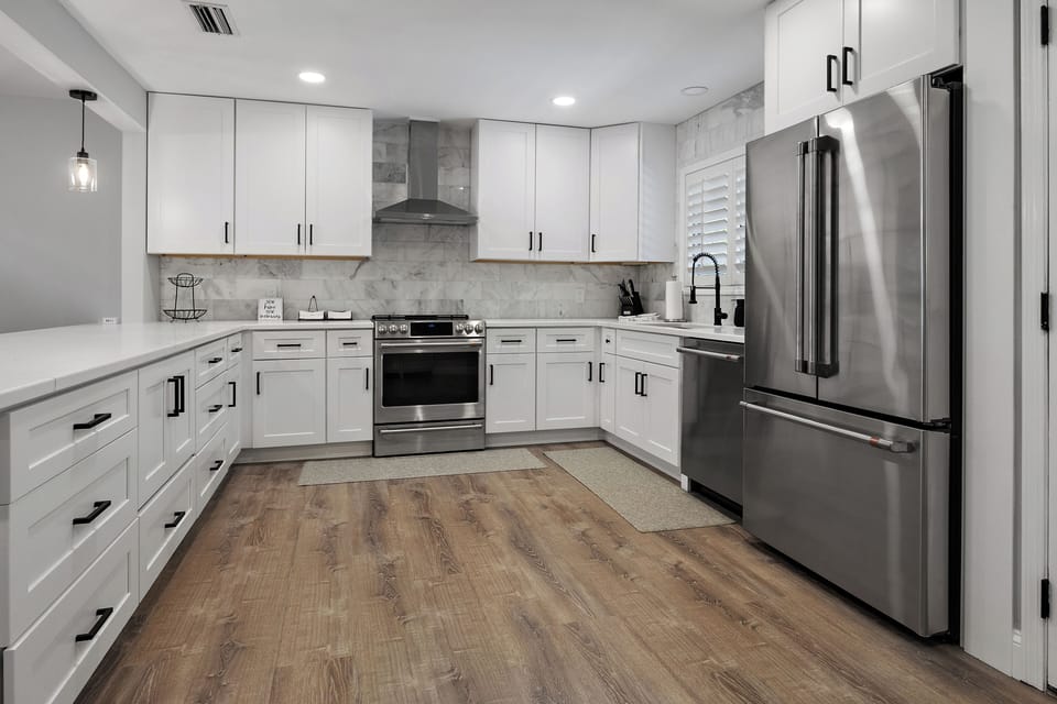 Kitchen with all new appliances, utensils and cooking ware