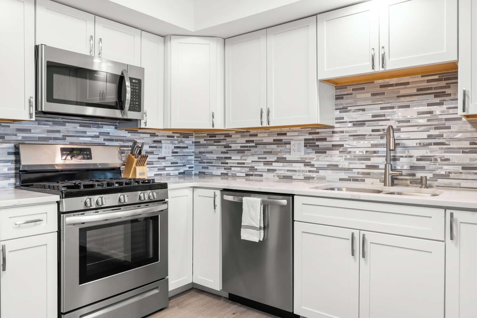 Stainless steel appliances make cooking here a breeze. - The Solstice - Lake Ozark, MO