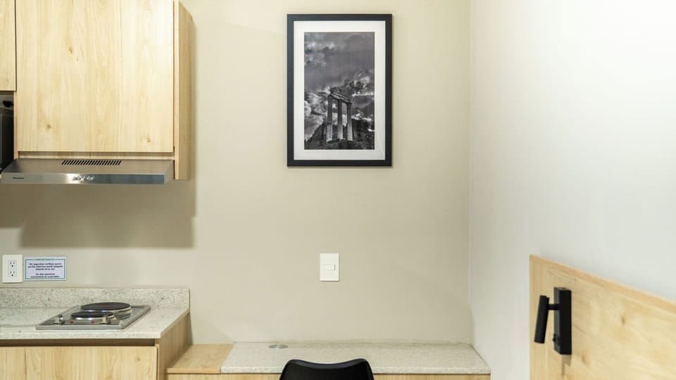 Comfort Room, Patio, Courtyard View | Minibar, in-room safe, desk, laptop workspace