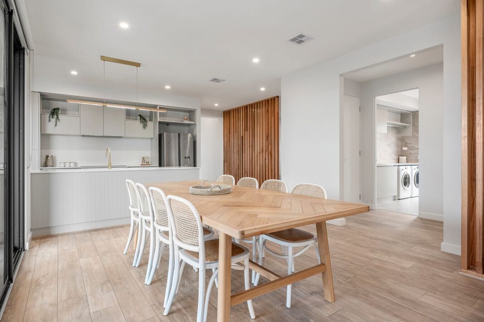 Bright dining space connected to modern kitchen